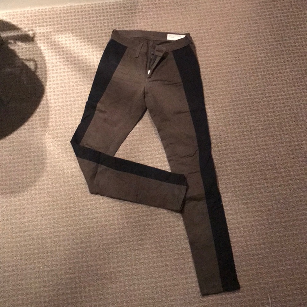 Army green and black rag and bone jeans.